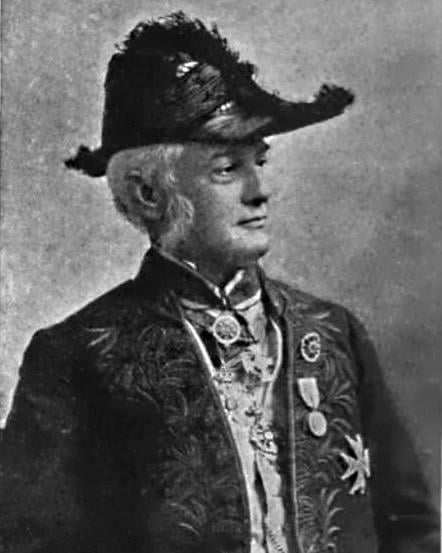 Müller c. 1898, wearing his Habit vert costume with the insignia of the order Pour le Mérite and the Bavarian Maximilian Order for Science and Art
