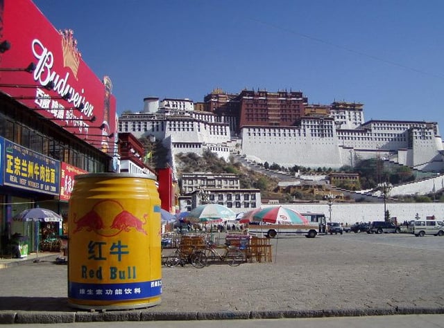 In front of the Potala Palace, Tibet: a model of Red Bull in Chinese version is displayed.