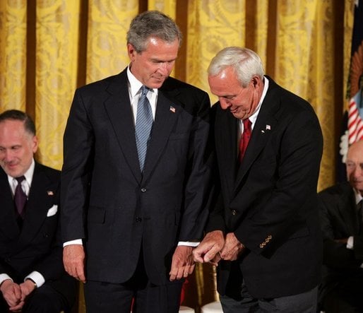 Palmer gives President Bush golf tips before being awarded the Presidential Medal of Freedom, 2004