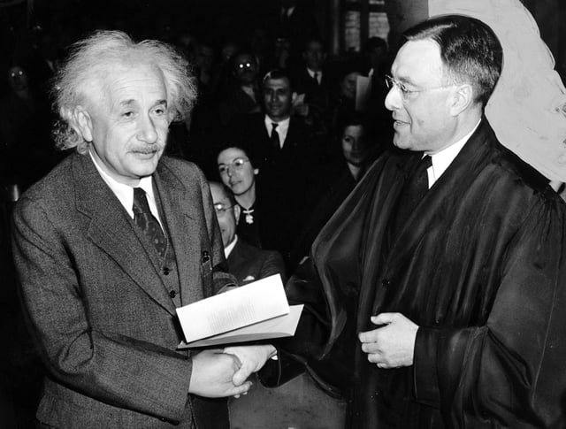 Einstein accepting US citizenship certificate from judge Phillip Forman