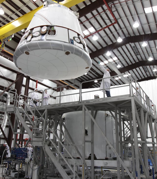 COTS 2 Dragon capsule being lowered onto its trunk at LC-40 on 16 November 2011 during pre-launch processing.