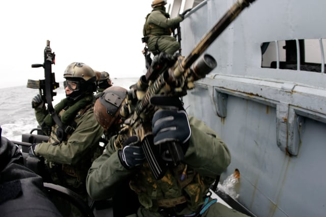 US Navy SEALs and Grom—Polish naval warfare team members—practicing boarding skills near Gdansk, Poland, 2009
