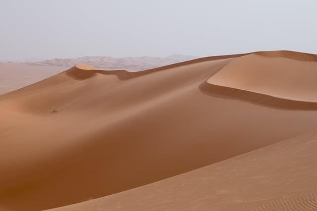 Reversing dune showing short minor slipface atop the major stoss (upwind) face