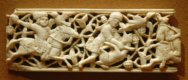 Arabesque pattern behind hunters on ivory plaque, 11th–12th century, Egypt