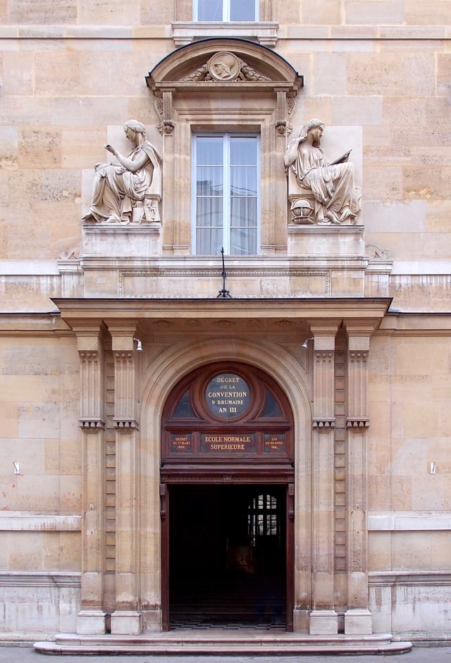 Entrance of the historic building of the ENS, at 45, rue d'Ulm. The inscriptions on the pediment of the monumental doorway display the school's two dates of creation (the first, in the oculus, under the National Convention) and date of installation in this premise.