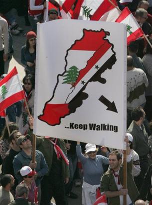 Demonstrators calling for the withdrawal of Syrian forces.