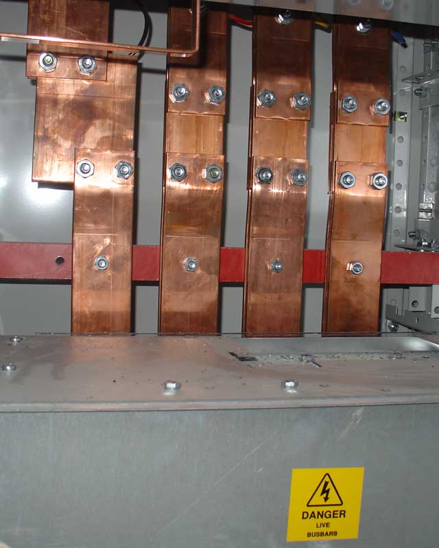 Copper electrical busbars distributing power to a large building