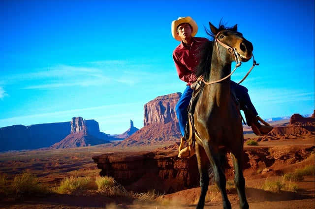 A Navajo man on horseback in Monument Valley, Arizona, United States