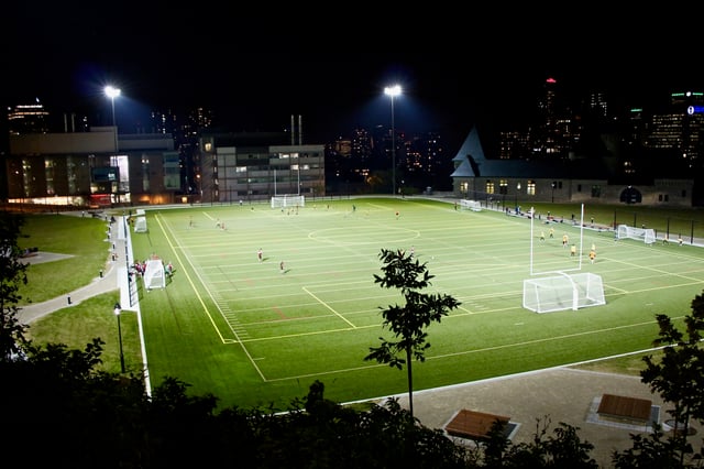 Parc Rutherford at night. The Genome Building (left), Wong Building (middle), and McTavish Reservoir (right) are seen in the background.