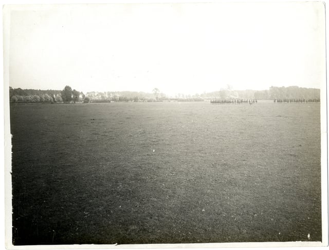 A very distant view of the King's Dragoon Guards charging across open country in France in July 1915