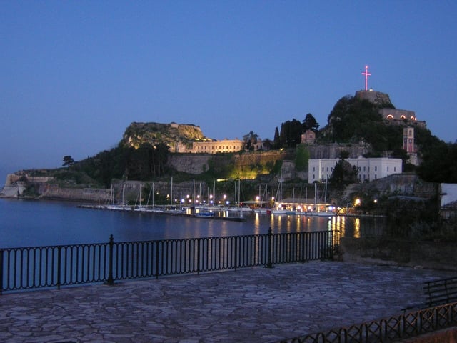The northern side of the Venetian Old Fortress at night. The Great Cross can be clearly seen as described in the Palaio Frourio section of this article.