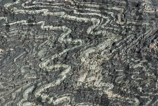 Tightly folded serpentinite from the  Tux Alps, Austria. Closeup view about 30cm × 20cm.