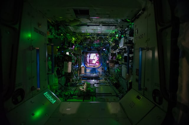 Interior view of the US lab with the lights turned off, i.e. while the crew sleeps