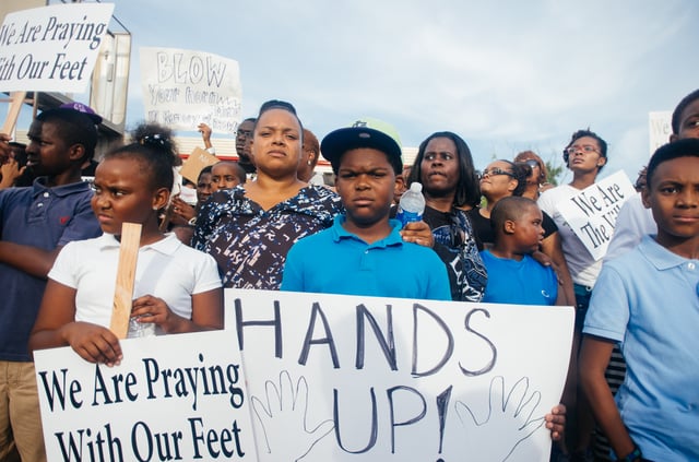 "Hands up!" sign displayed at a Ferguson protest