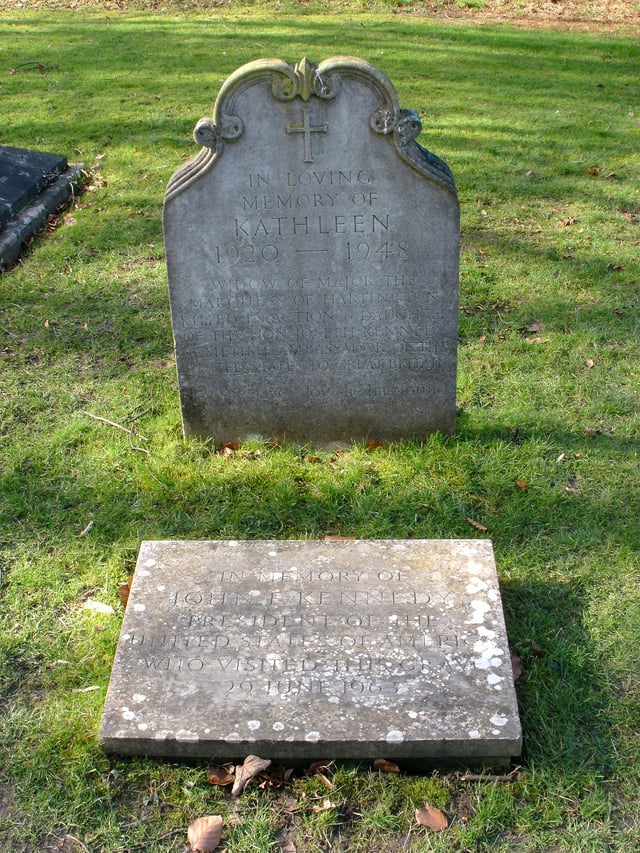 St Peter's Churchyard, Edensor - grave of Kathleen Cavendish, Marchioness of Hartington (née Kennedy, 1920–1948). Her grave is marked with a headstone and a plaque in the ground commemorating the visit of 35th U.S. President John F. Kennedy at the gravesite. On her gravestone, it says "Joy she gave joy she has found"
