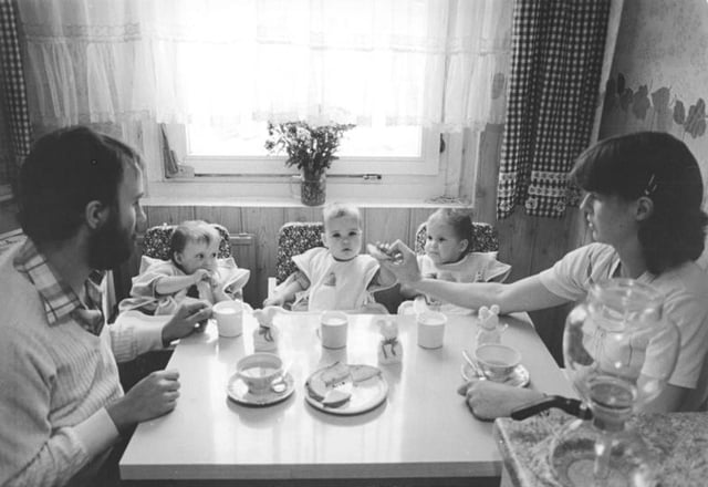 Woman and her husband, both medical students, and their triplets in East Germany in 1984. GDR had state policies to encourage births among educated women.
