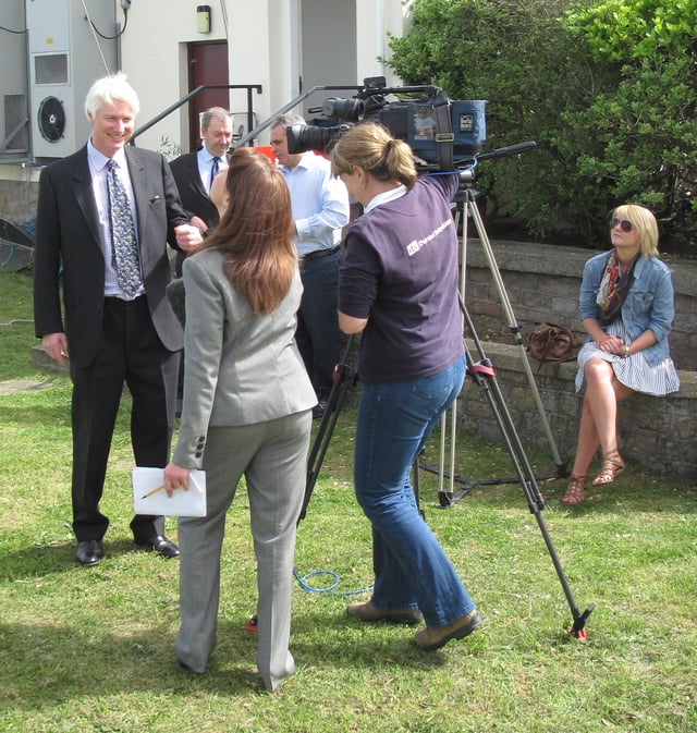 A Channel Television crew interview the Bailiff of Jersey