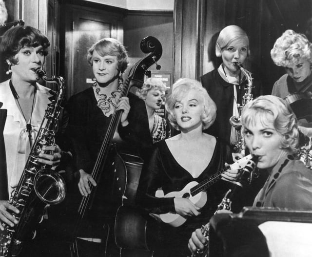 With Tony Curtis and Jack Lemmon in Billy Wilder's Some Like It Hot (1959), for which she won a Golden Globe