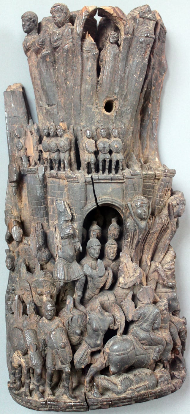 Stone-carved relief depicting the liberation of a besieged city by a relief force, with those defending the walls making a sortie. Western Roman Empire, early 5th century AD