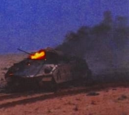A Bradley IFV burns after being hit by Iraqi T-72 fire