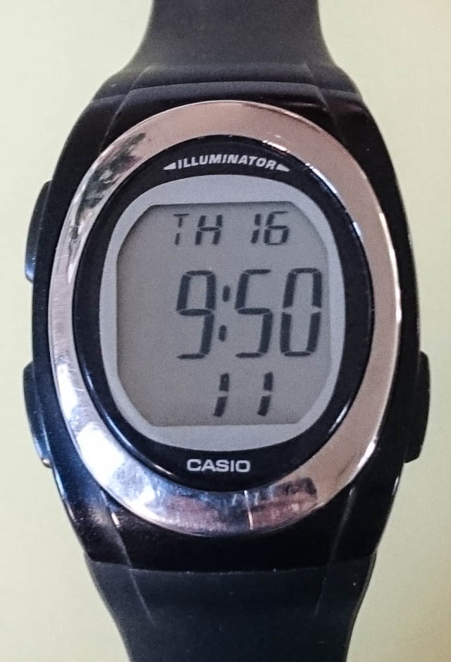 Digital LCD wristwatch Casio type F-E10 with electroluminescent backlighting.