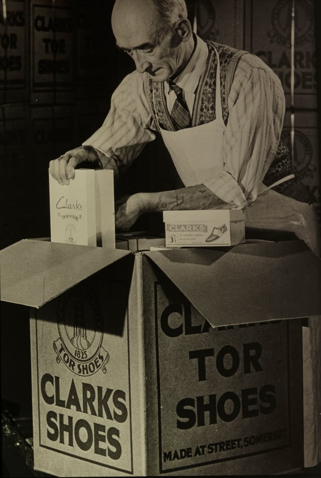 An employee carefully packing some of the premium Clarks Tor products