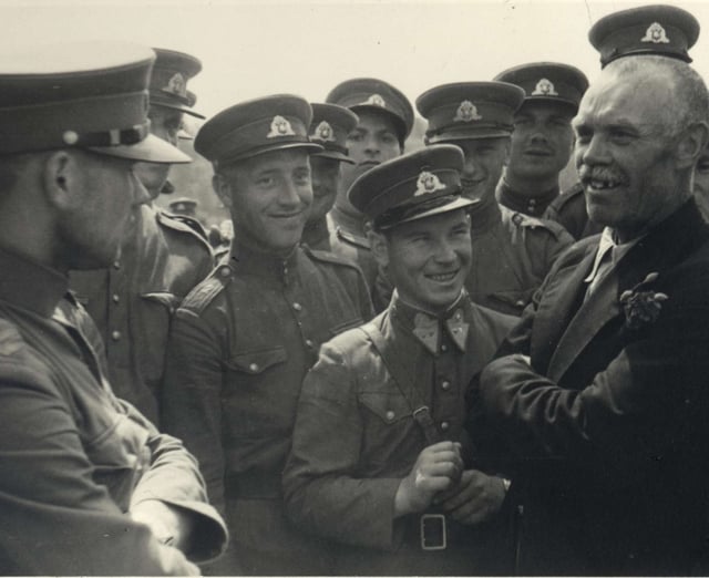 Soviet political leader (without military shoulder straps) and the People's Seimas member (with red rose in his jacket lapel) announces to the Lithuanian People's Army non-commissioned officers that "soon you will become members of the Red Army" in Kaunas, 1940