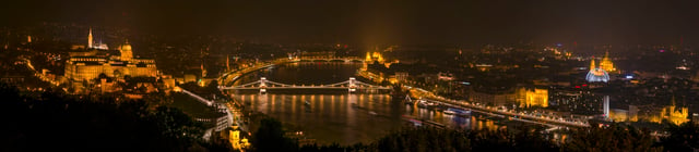 Night panorama of the Gellért Hill with the illuminated Buda Castle, Matthias Church, Danube Chain Bridge, Parlament, Hungarian Academy of Sciences, St. Stephen's Basilica, Budapest Eye and Vigadó Concert Hall