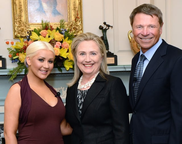 Aguilera (left) and Novak (right) were honored with the George McGovern Leadership Award in October 2012 for their contributions to the United Nations World Hunger Relief effort, while Clinton (center) was given a special tribute