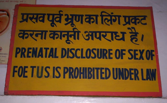 Sign in an Indian clinic reading "Prenatal disclosure of sex of foetus is prohibited under law" in English and Hindi