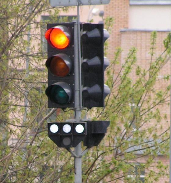 Four-lamp public transport traffic light in Moscow, Russia, showing "stop" signal.