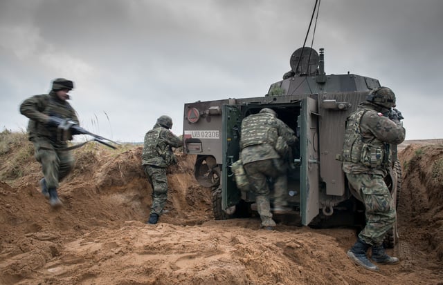 Crew of a KTO Rosomak armored personnel carrier during a NATO exercise at the Military Training Area near Drawsko Pomorskie