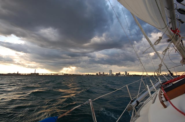 Milwaukee's skyline visible from a sailboat out on Lake Michigan