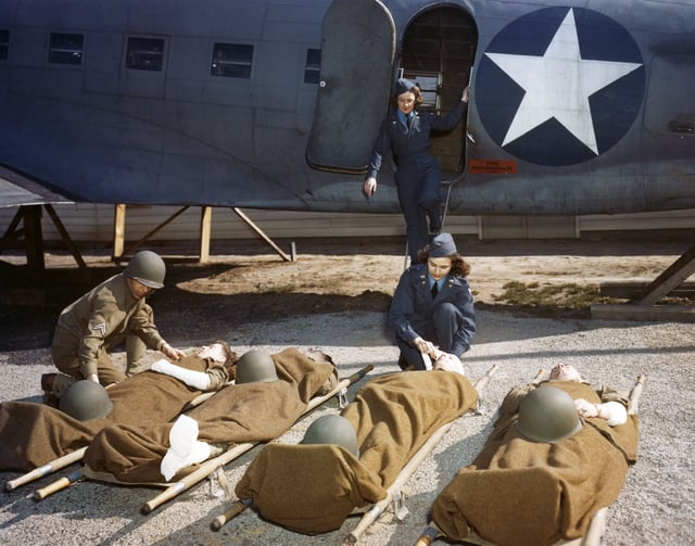 At the AAF School of Air Evacuation at Bowman Field, Ky., student flight nurses learned how to handle patients with the aid of a mock-up fuselage of a Douglas C-47 transport.