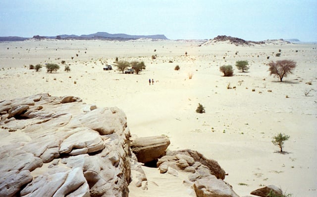 Desert near Agadez, with the Aïr Mountains in the distance. Note the volcanic outcrops, common to the Aïr.