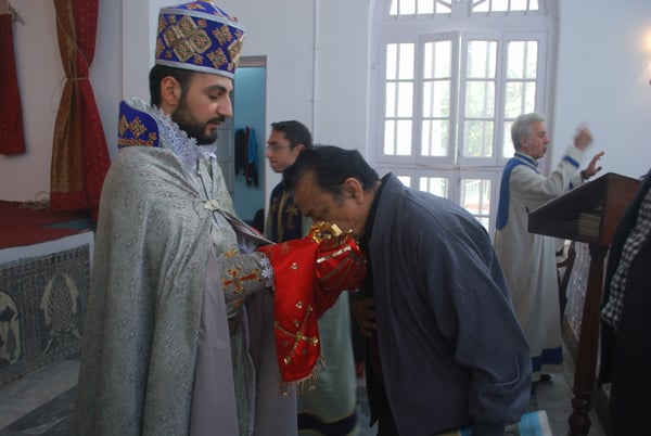 A Calcutta Armenian kisses the hand of a priest of Saint John the Baptist, Chinsurah