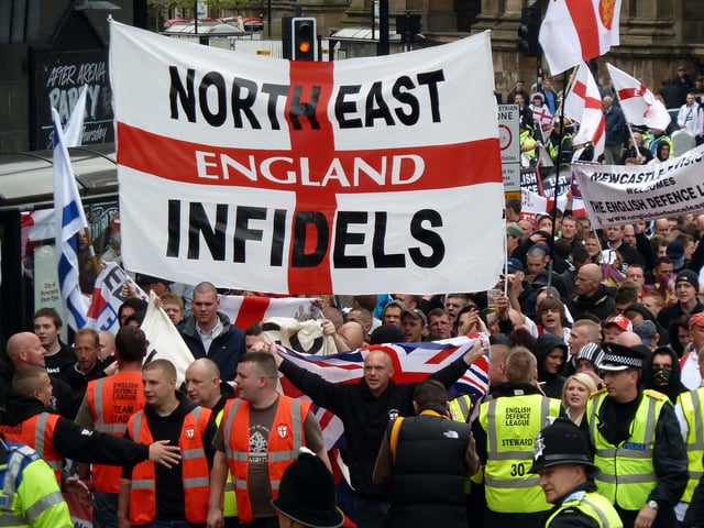 The National Front cooperated with the North West Infidels and South East Alliance, groups that splintered from the English Defence League (rally depicted).