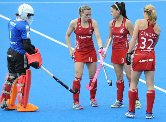 Great Britain's women's hockey players with their goal-keeper during a 2016 Champions Trophy match.
