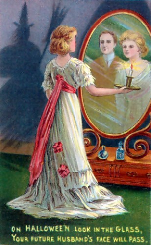 In this 1904 Halloween greeting card, divination is depicted: the young woman looking into a mirror in a darkened room hopes to catch a glimpse of her future husband.