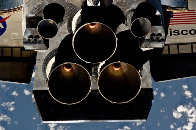 The Space Shuttle Main Engine with the two Orbital Maneuvering System (OMS) pods.