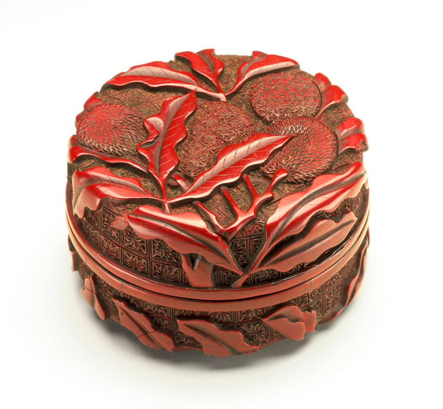 A Ming dynasty red "seal paste box" in carved lacquer.