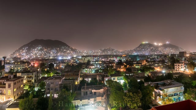 Night scene in Kabul in 2016, with three mountains visible