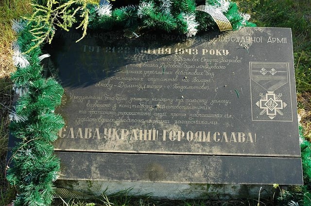 World War II-era monument in memory of UPA fighters with inscription "Glory to Ukraine! Glory to the heroes!", in place of the Janowa Dolina massacre, Bazaltove, Ukraine