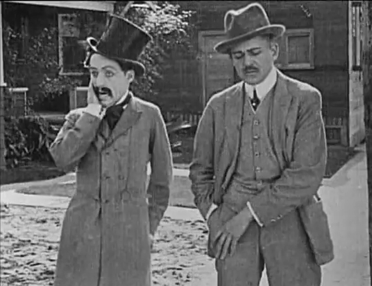Chaplin (left) in his first film appearance, Making a Living