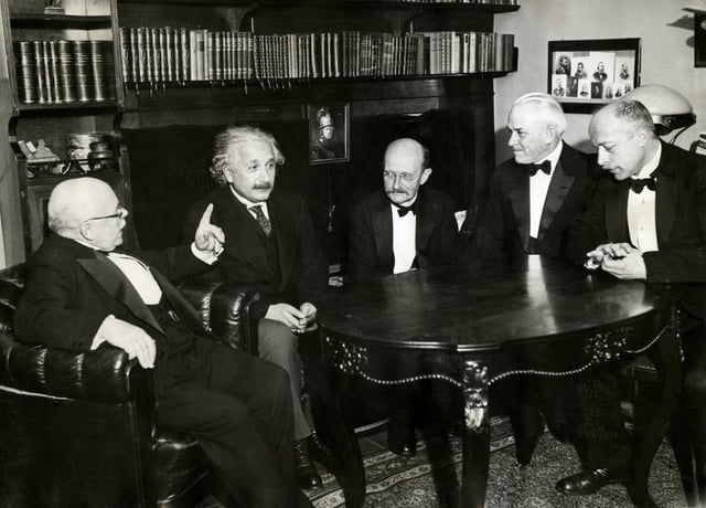 From left to right: W. Nernst, A. Einstein, M. Planck, R.A. Millikan and von Laue at a dinner given by von Laue in Berlin on 11 November 1931