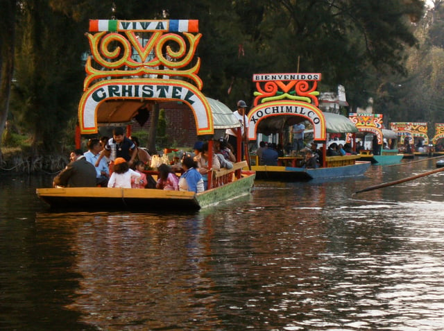 Trajineras in the canals of Xochimilco. Xochimilco and the historic center of Mexico City were declared a World Heritage Site in 1987.