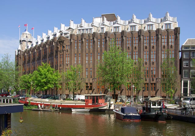 The Scheepvaarthuis, by architects Johan van der Mey, Michel de Klerk, Piet Kramer is characteristic of the architecture of the Amsterdam School.