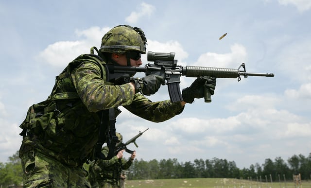 A Canadian soldier fires the current issue C7A2 rifle at the range with a C79A2 sight. This particular example is missing the standard TRIAD mount.