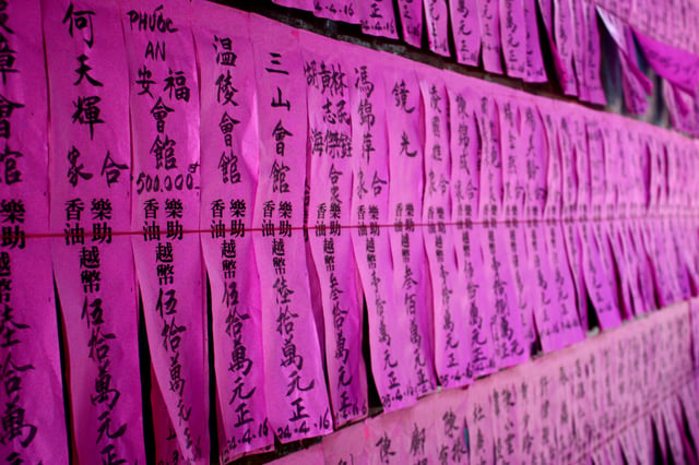 Vows to a deity at a Chinese temple in Vietnam.