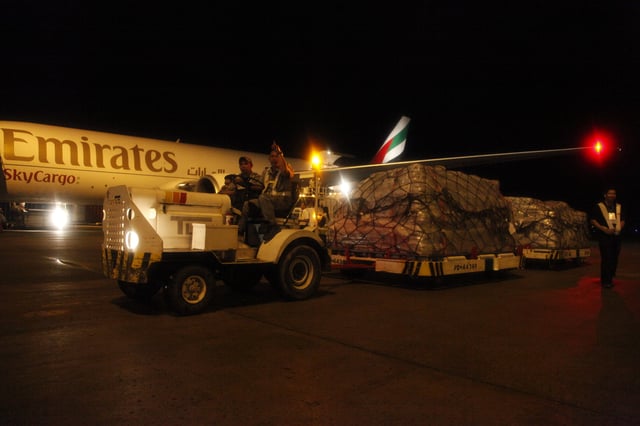 A Boeing 777F operated by Emirates SkyCargo at the airport with relief goods for Typhoon Haiyan/Yolanda donated by the United Kingdom's Department for International Development